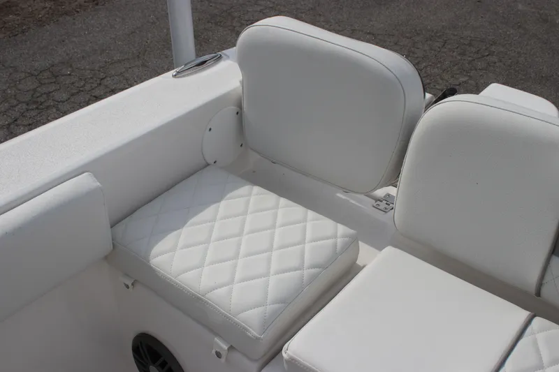 Slide: The Image of 2026 Sea Fox 248 Commander boat seating with white cushioned upholstery. - 5