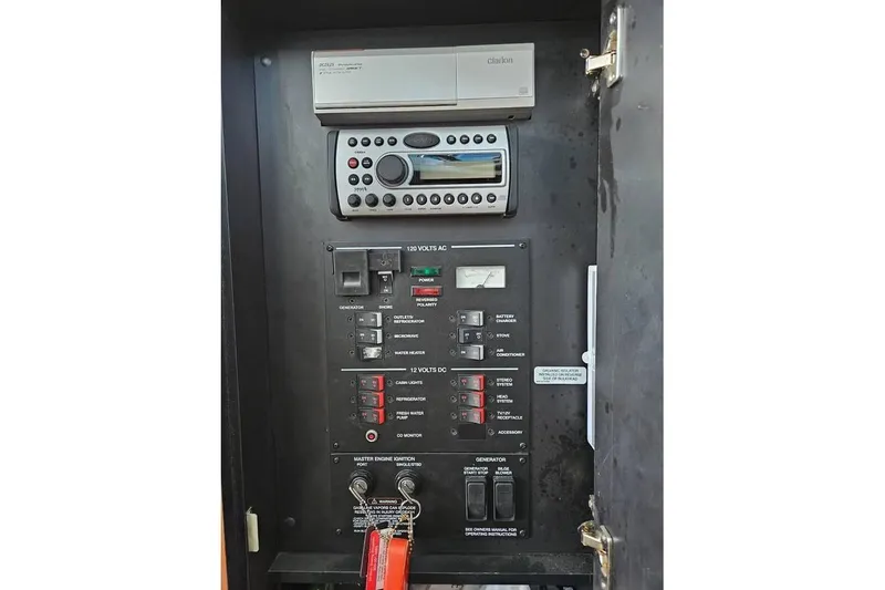 Slide: The Image of Electrical control panel of a 2006 Sea Ray 290 Sundancer boat with Clarion stereo system. - 15