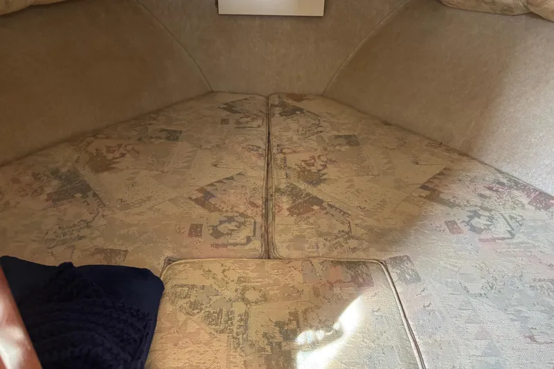 Slide: The Image of Interior cabin of a 2004 Camano Trawler with patterned upholstery. - 13