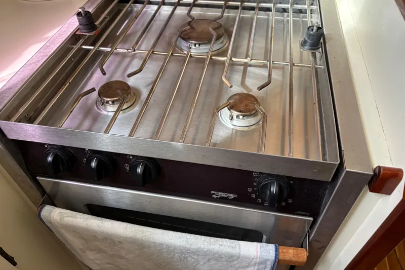 Slide: The Image of Stainless steel stove and oven in 2004 Camano Trawler kitchen. - 17