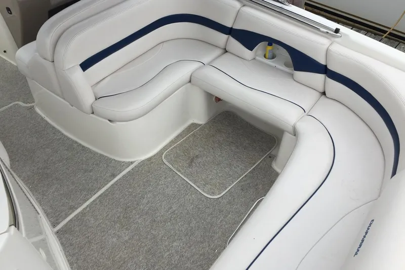 Slide: The Image of 1999 Chaparral 2830 SS boat interior with white and blue cushioned seating. - 7