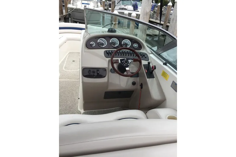 Slide: The Image of 1999 Chaparral 2830 SS boat dashboard with steering wheel and gauges. - 8