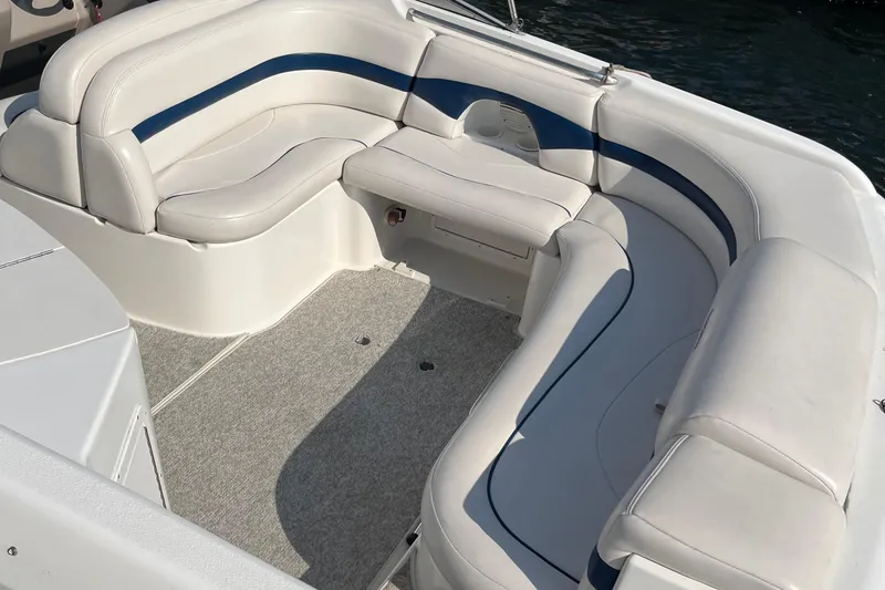 Slide: The Image of 1999 Chaparral 2830 SS boat interior with white and blue seating. - 9