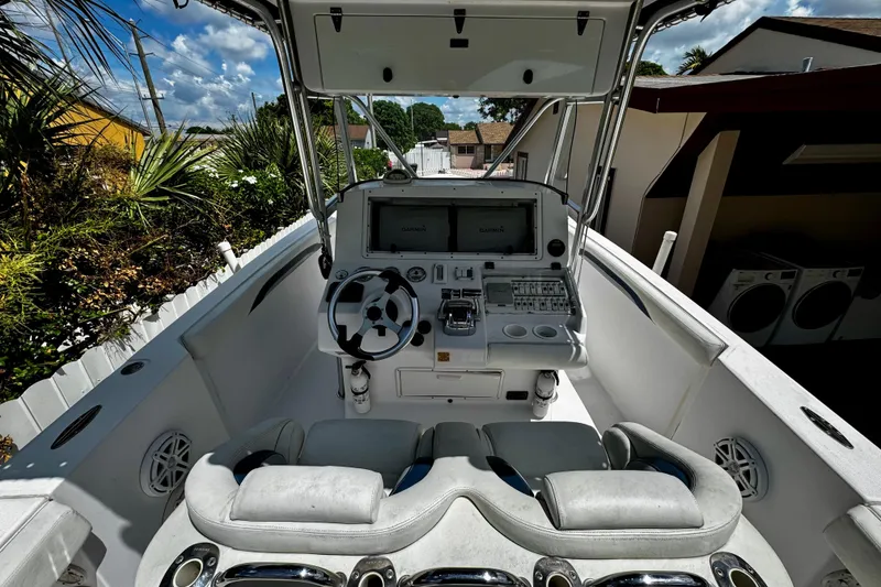 Slide: The Image of 2006 Donzi 32 ZF boat cockpit with steering wheel and navigation system. - 10