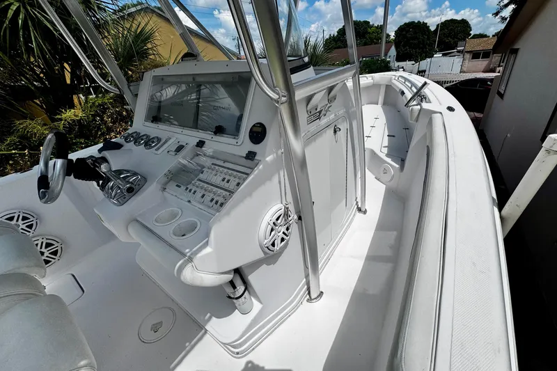 Slide: The Image of 2006 Donzi 32 ZF boat interior with steering console and seating. - 11