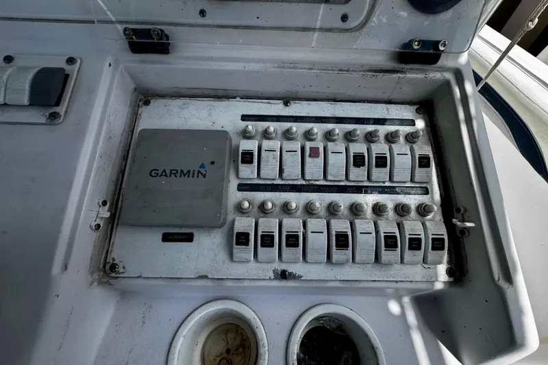 Slide: The Image of Control panel of a 2006 Donzi 32 ZF boat with Garmin autopilot system. - 14