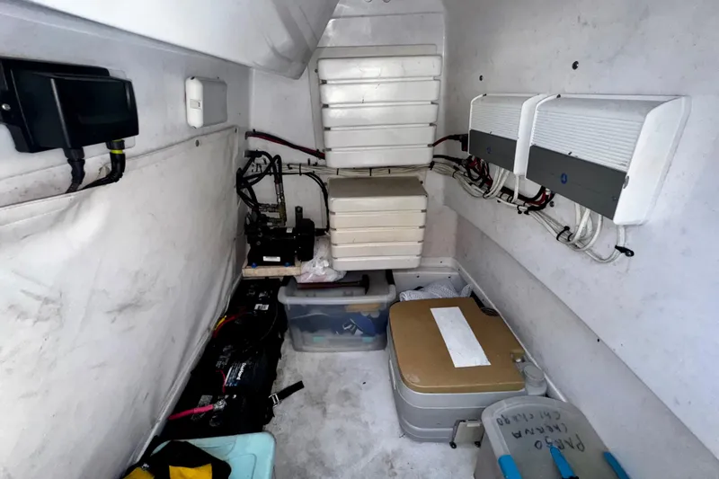 Slide: The Image of Interior of a 2006 Donzi 32 ZF boat showing storage and electrical components. - 15