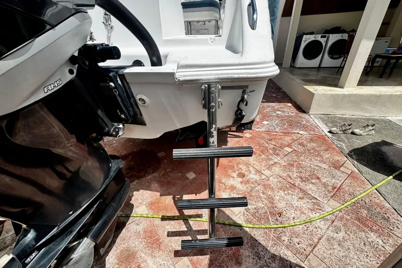 Slide: The Image of 2006 Donzi 32 ZF boat with ladder and motor on a tiled surface. - 4