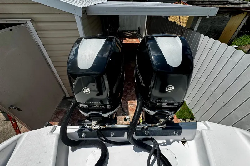 Slide: The Image of 2006 Donzi 32 ZF boat with dual Mercury outboard engines in a driveway. - 5
