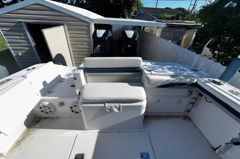 Slide: The Image of 2006 Donzi 32 ZF boat interior with seating and dual outboard engines. - 6
