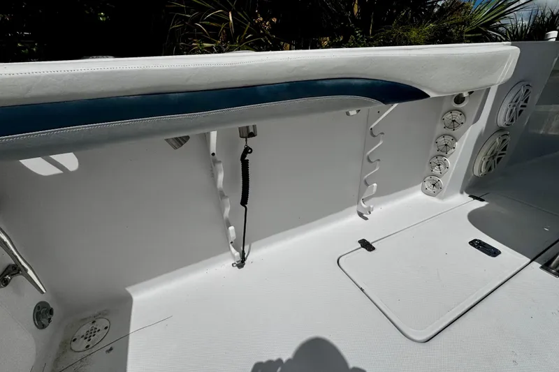 Slide: The Image of 2006 Donzi 32 ZF boat interior with rod holders and speakers. - 8