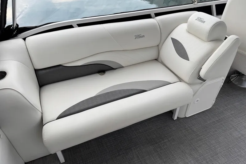 Slide: The Image of Luxurious seating on 2017 JC SportToon 24TT boat, featuring elegant white and gray upholstery. - 13