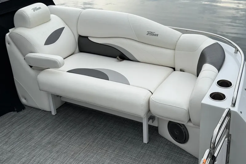 Slide: The Image of Luxurious white seating on 2017 JC SportToon 24TT boat with cup holders and speaker. - 4