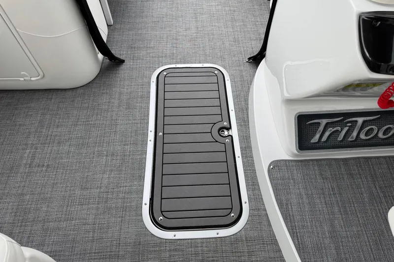 Slide: The Image of 2017 JC SportToon 24TT boat deck with gray flooring and storage hatch. - 9
