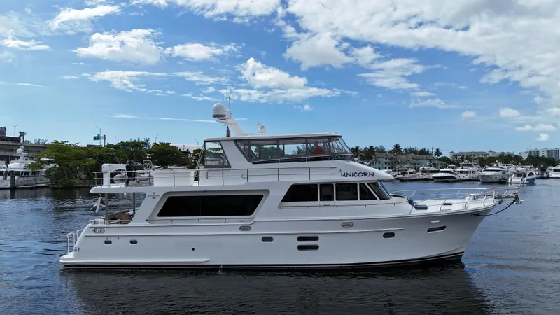 Slide: The Image of 2020 Hampton 658l Endurance yacht on a sunny day, docked in a marina. - 21