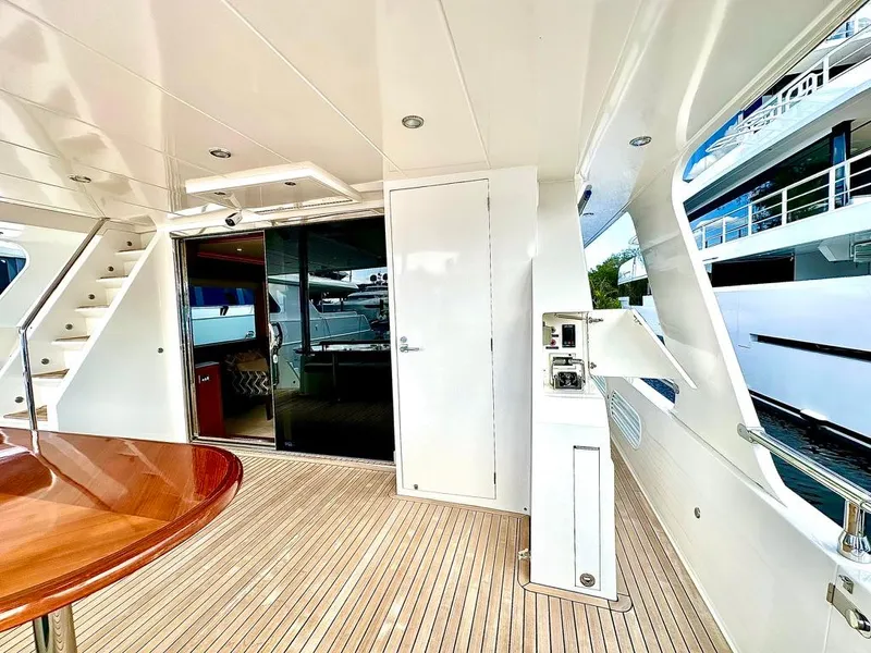 Slide: The Image of Luxurious 2020 Hampton 658l Endurance yacht deck with wooden flooring and modern amenities. - 47