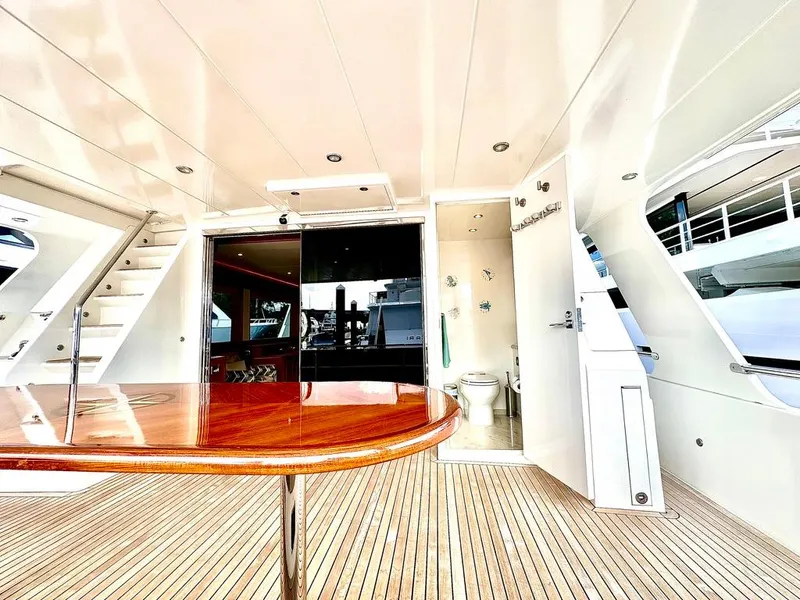 Slide: The Image of Luxurious 2020 Hampton 658l Endurance yacht interior with wooden table and modern amenities. - 49