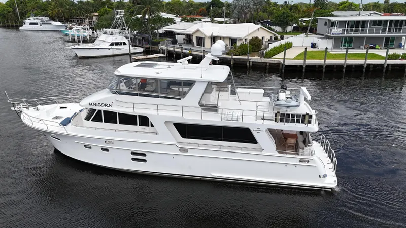 Slide: The Image of 2020 Hampton 658l Endurance yacht cruising on a calm waterway. - 5