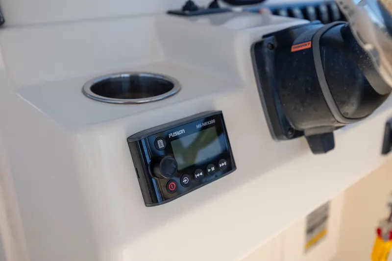 Slide: The Image of Control panel of 2017 Grady-White Freedom 235 boat with Fusion MS-NRX300 audio system. - 21