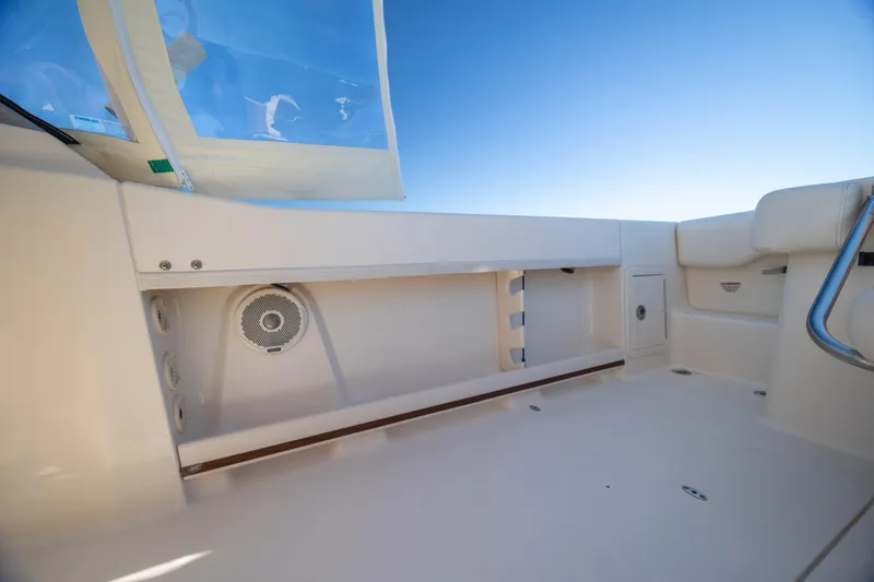 Slide: The Image of 2017 Grady-White Freedom 235 boat interior with speaker and storage compartment. - 35