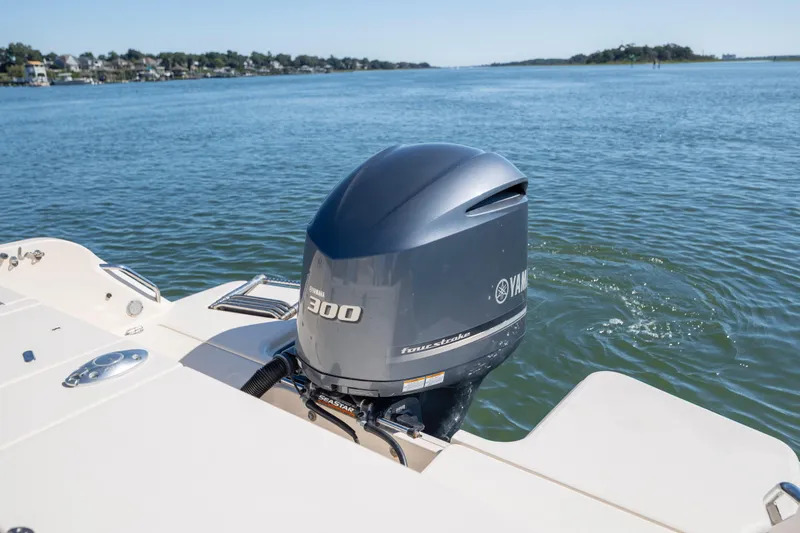 Slide: The Image of 2017 Grady-White Freedom 235 boat with Yamaha 300 outboard motor on calm water. - 37