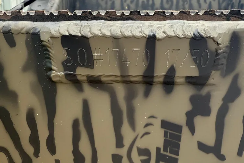 Slide: The Image of 2026 Gator Tail 1750 MID DECK SAVAGE boat with camouflage pattern and serial number engraving. - 10