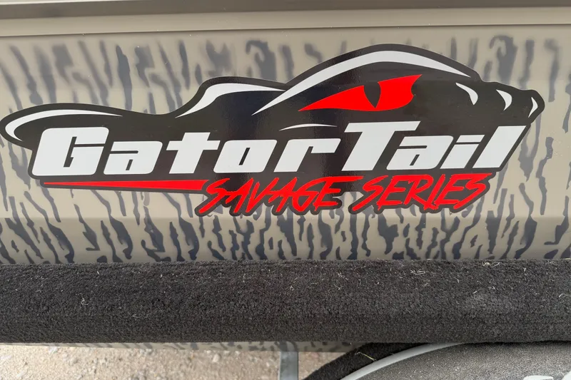 Slide: The Image of Gator Tail 1750 MID DECK SAVAGE 2026 logo with bold design and red accents. - 12