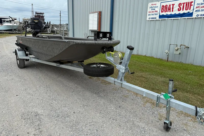 Slide: The Image of 2026 Gator Tail 1750 MID DECK SAVAGE boat on trailer outside dealership. - 2