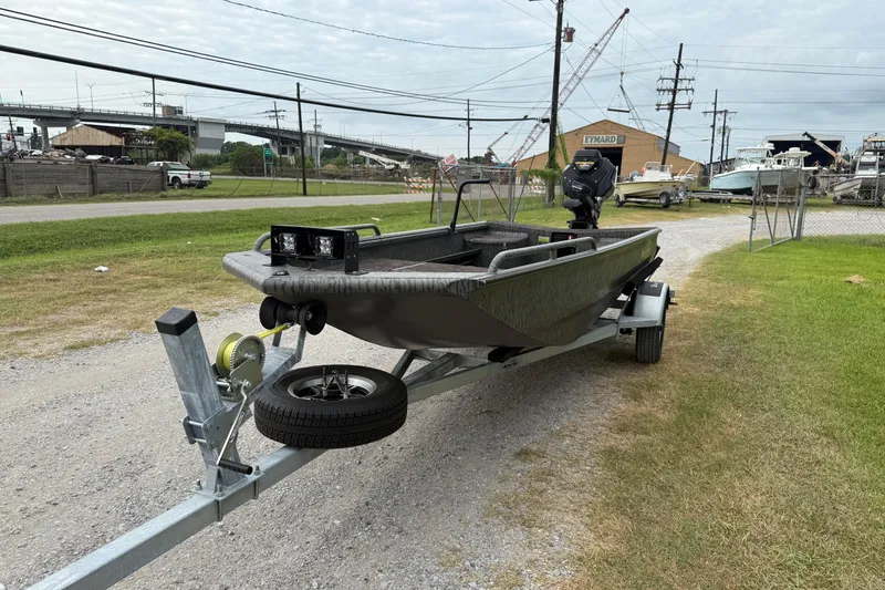 Slide: The Image of 2026 Gator Tail 1750 MID DECK SAVAGE boat on trailer, outdoor setting. - 3