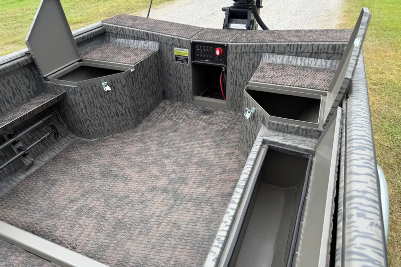 Slide: The Image of 2026 Gator Tail 1750 MID DECK SAVAGE boat interior with storage compartments. - 7