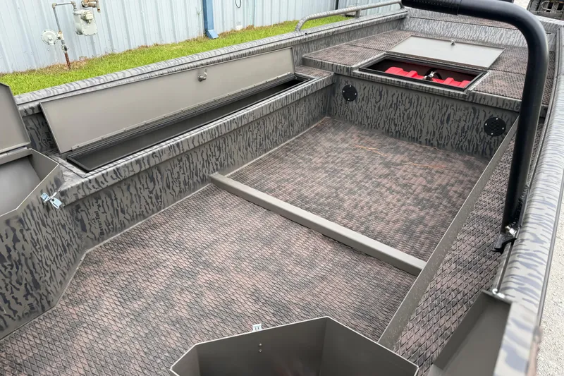 Slide: The Image of 2026 Gator Tail 1750 MID DECK SAVAGE boat interior with storage compartments and textured flooring. - 8