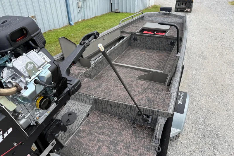 Slide: The Image of 2026 Gator Tail 1750 MID DECK SAVAGE boat with motor, parked on gravel. - 9