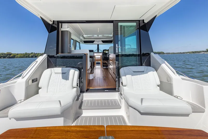 Slide: The Image of Manufacturer Provided Image: 2025 Tiara Yachts 43 LE luxury yacht with sun loungers and sleek interior design. - 3