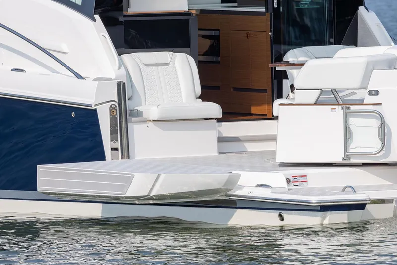 Slide: The Image of Manufacturer Provided Image: 2025 Tiara Yachts 43 LE boat with elegant seating and swim platform. - 7