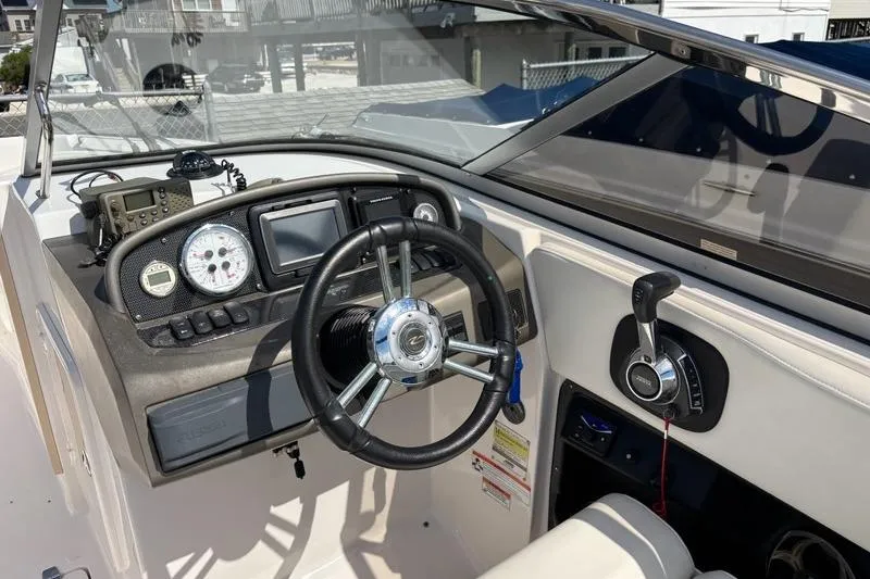 Slide: The Image of 2010 Regal 2700 ES Bowrider interior with white seating and blue accent. - 10