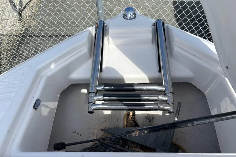 Slide: The Image of 2010 Regal 2700 ES Bowrider interior with sink and seating area. - 14