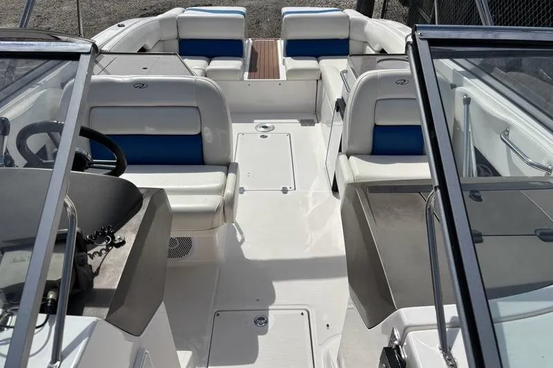 Slide: The Image of Bow anchor compartment with ladder on 2010 Regal 2700 ES Bowrider boat. - 15
