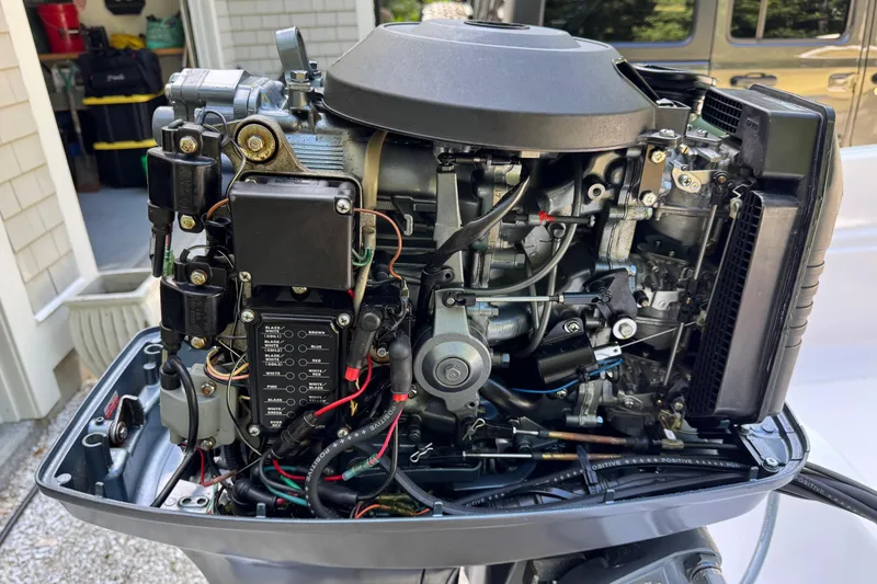 Slide: The Image of Open engine of a 1978 Boston Whaler Currituck boat, showcasing intricate mechanical components. - 8