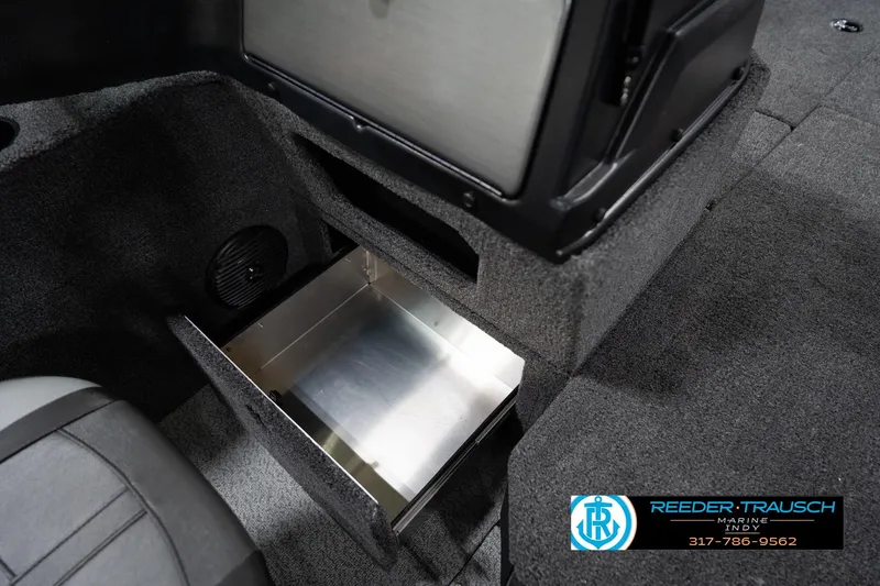 Slide: The Image of 2026 Lund 1875 Impact XS boat interior with open storage compartment. - 29