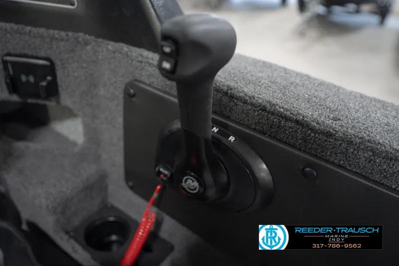 Slide: The Image of 2026 Lund 1875 Impact XS boat throttle control with Reeder-Trausch Marine branding. - 41
