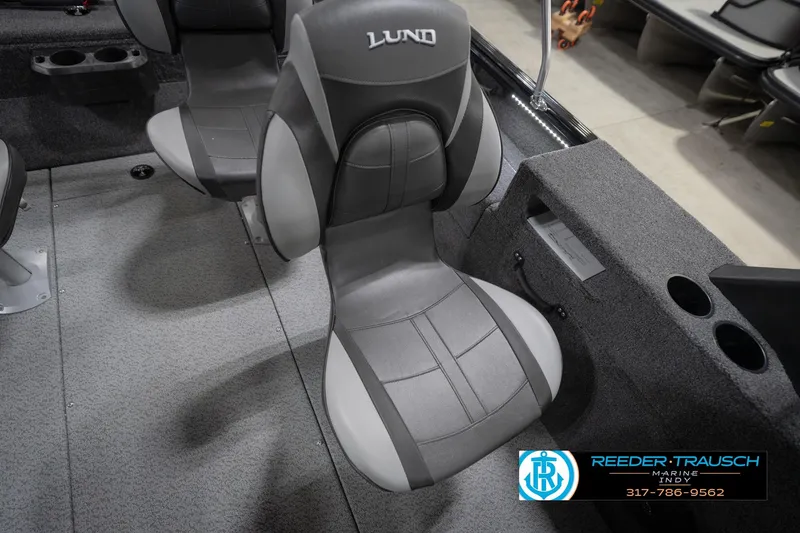 Slide: The Image of 2026 Lund 1875 Impact XS boat interior with gray seating and cup holders. - 44