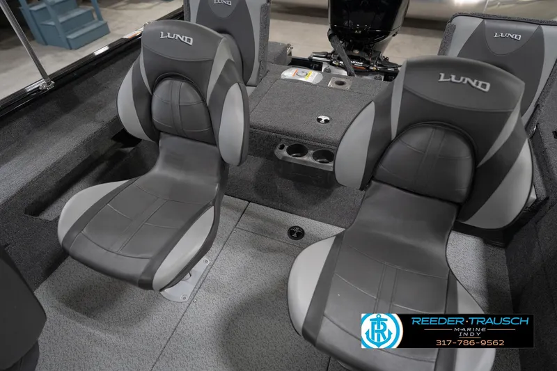 Slide: The Image of 2026 Lund 1875 Impact XS boat interior with two gray seats and console. - 45