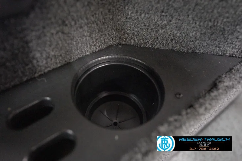 Slide: The Image of Cup holder in 2026 Lund 1875 Impact XS boat interior, featuring carpeted surface. - 48