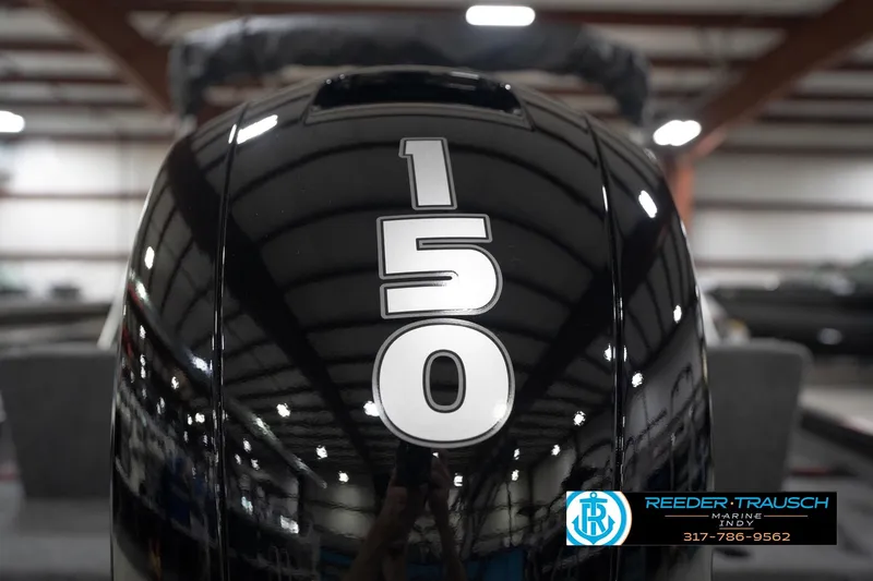 Slide: The Image of Close-up of a 150 HP outboard motor on a 2026 Lund 1875 Impact XS boat. - 52