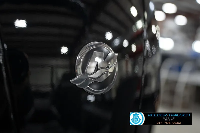 Slide: The Image of 2026 Lund 1875 Impact XS logo on glossy black surface, Reeder-Trausch Marine branding. - 53