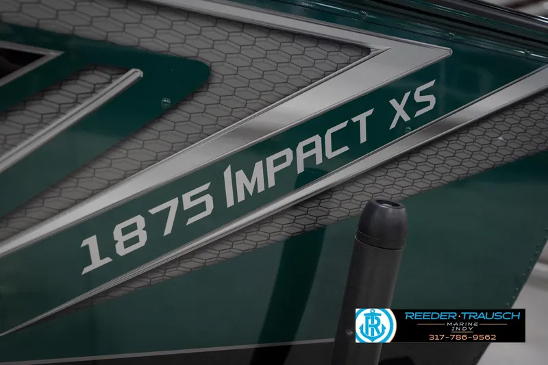 Slide: The Image of 2026 Lund 1875 Impact XS boat with sleek design and Reeder-Trausch Marine logo. - 56