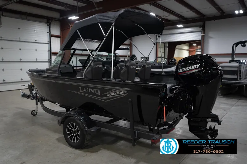 Slide: The Image of 2026 Lund 1800 Explorer Sport boat with Mercury engine in showroom. - 10
