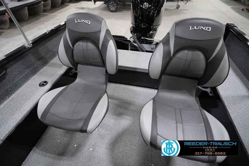 Slide: The Image of 2026 Lund 1800 Explorer Sport boat interior with two gray seats. - 100