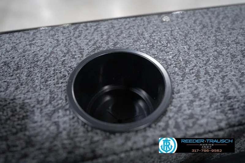 Slide: The Image of Cup holder on 2026 Lund 1800 Explorer Sport boat with textured surface. - 101