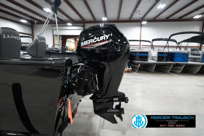 Slide: The Image of 2026 Lund 1800 Explorer Sport with Mercury outboard motor in showroom. - 103
